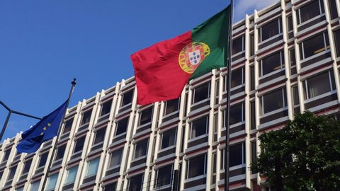 Lisbon, Portugal - December 14th 2020 - Flags of Portugal and European Union shaking waving on the wind.
