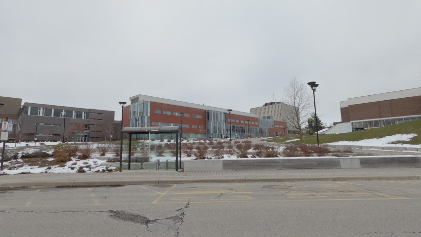 Waterloo, Ontario, Canada December 2020 POV side view empty University and college town during COVID 19 pandemic lockdown