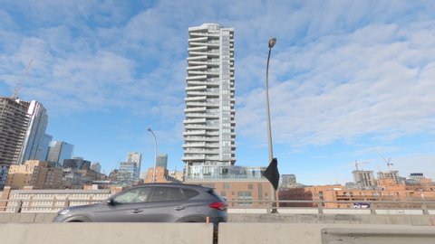 Toronto, Ontario, Canada December 2020 POV side view driving into downtown Toronto skyline office towers and condos