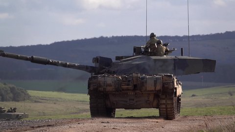 close up action shot of a British Army Challenger 2 FV4034 Main Battle Tank on a military exercise, Salisbury Plain, Wiltshire UK