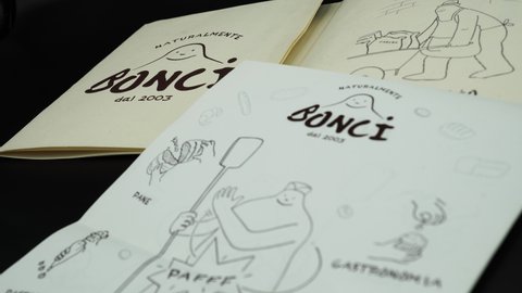 Rome, November 09, 2020: Logo and flyers of the BONCI pizzeria and bakery. By Gabriele Bonci master of baking and leavening also known for his condiments and never banal combinations