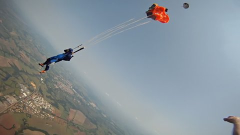 Skydiver open his parachute. From high speed to stop.