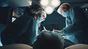 Cooperating team of multi-ethnic surgeous perform organ transplant operation surgery in modern operating office room. Medical staff. Surgical concept. - Powered by Shutterstock - Get 15% off with code: PIKWIZARD15