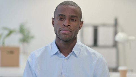 Portrait of No Sign by African Man by Head Shake in Office