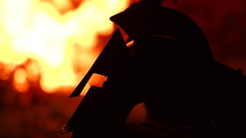 Cinematic Ancient Warrior Helmet In Front Of Fire