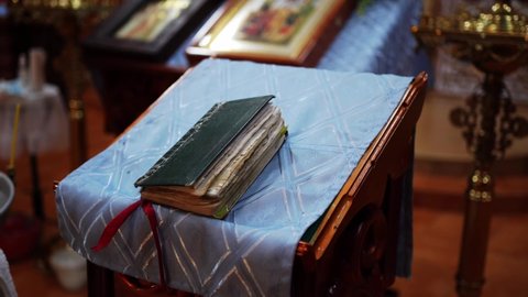 old prayer book. Lectern is a stand for icons and books. In the Orthodox Church, this is the table on which during the service in the church are church books. baptism or wedding.