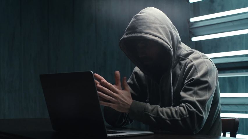 Unrecognizable hacker man stretching hands and starting to typing on laptop keyboard and breaking password. Male engaging hacking into security systems. Freelancer using laptop working from home. Royalty-Free Stock Footage #1064121991