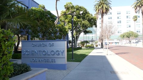 Los Angeles, California USA - 24 Feb 2020: Church of Scientology exterior, facade of blue building near American Saint Hill Organization in Hollywood. Sign on street. International religious movement.