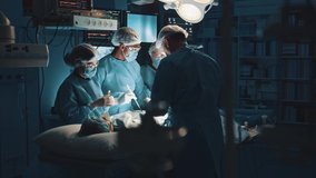 Multi-ethnic cooperating team of doctors and surgeons processing surgical operation in operating room modern hospital emergency department. Heart surgery. - Powered by Shutterstock - Get 15% off with code: PIKWIZARD15