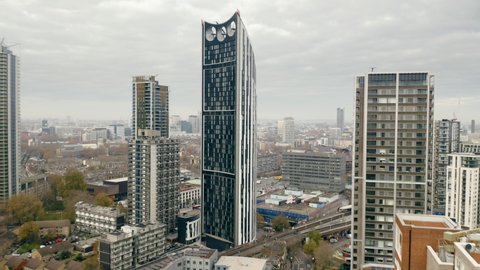 London, United Kingdom. Aerial view of business district in Central London. Side view of glass facades of skyscrapers. High quality 4k footage