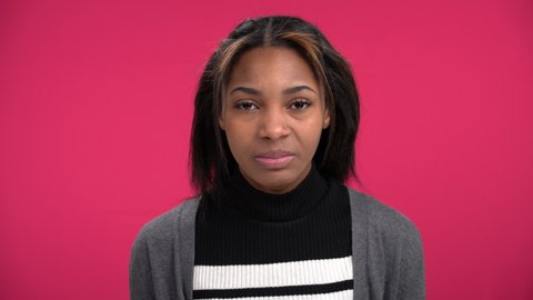 Attractive African-American woman disgusted by what she sees hears