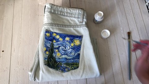 Kazan Russia December 10 2020 customized designed hand painted blue denim jeans Van Gogh Starry Night inspired art, embellished one of a kind unique clothing