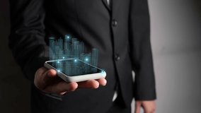 Businessman holds 3D city model showing augmented reality technology . Futuristic urban hologram screen in concept of virtual internet of things and global network connection . - Powered by Shutterstock - Get 15% off with code: PIKWIZARD15