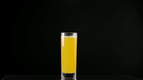 Slow motion video of falling ice cubes in orange juice - Powered by Shutterstock - Get 15% off with code: PIKWIZARD15