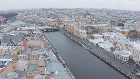 Flight over the Fontanka river in the historical center of St. Petersburg, tourist area of the city in winter
