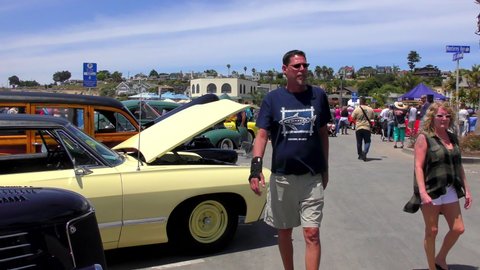 Unidentified people at the Capitola Rod and Custom Classic Car Show in Capitola by the Sea, California, USA, on the 9th of June, 2018