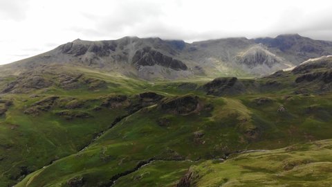 Aerial Drone Shot of Upper Eskdale with Scafell Pike, Sca Fell, Esk Pike and Bowfell. Lake District. UK