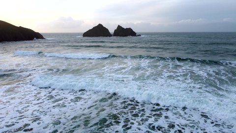 Holywell bay looking to carters rock in cornwall uk aerial drone footage 