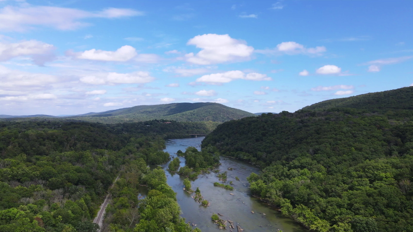 Flying over (aerial top view) West Virginia forests, Mountains and Potomac River on Blue sky background. 