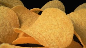 potato chips . Macro shot of golden chips 4k video