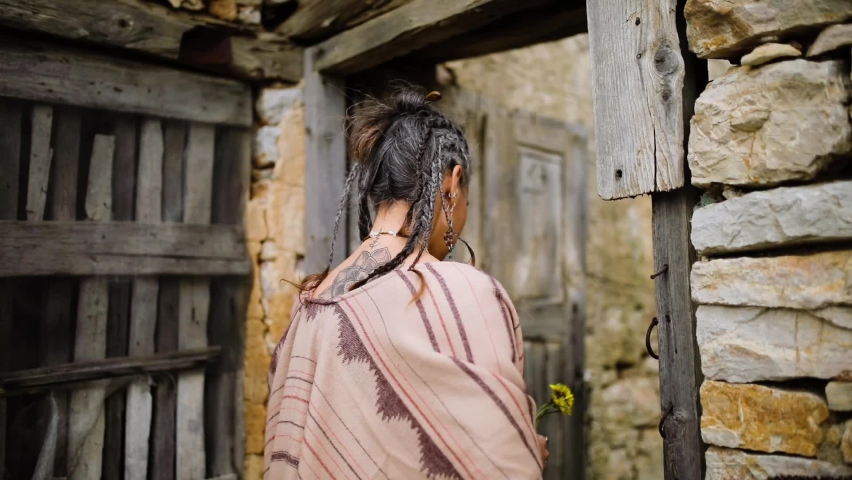 Beautiful women is enjoying herself in the ruined house.	