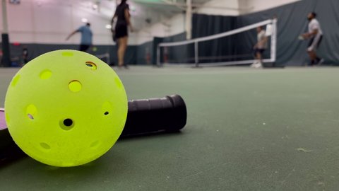 pickleball is being played indoors
