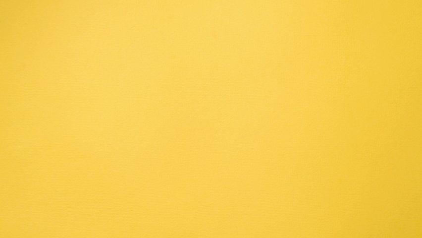 Eating strawberry cheesecake bite by bite, stop motion. Plate of cake moving in the frame. Food animation, top view, light yellow background