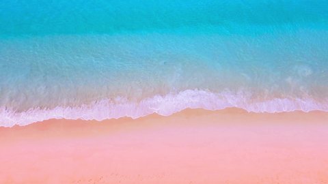 Top view Aerial view of drone Turquoise beach sea sand copy space. 4K Nature video travel tourism concept. Seawater wave and surf on sandy beach. Beach space area background. Nature and travel concept