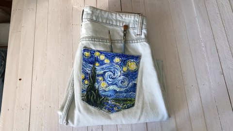 Kazan Russia December 10 2020 customized designed hand painted blue denim jeans Van Gogh Starry Night inspired art, embellished one of a kind unique clothing
