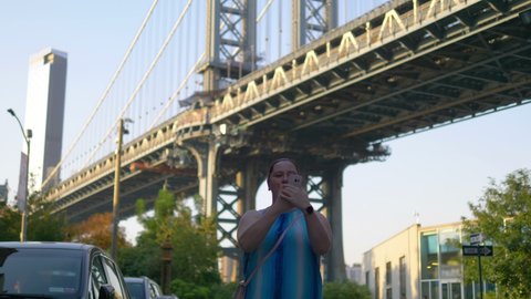 Girl Takes A Selfie in Dumbo in New York City in 4K Slow motion 60fps