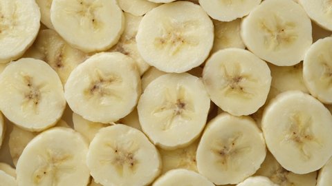 sliced banana top view rotation. 
pieces of the most popular banana fruit