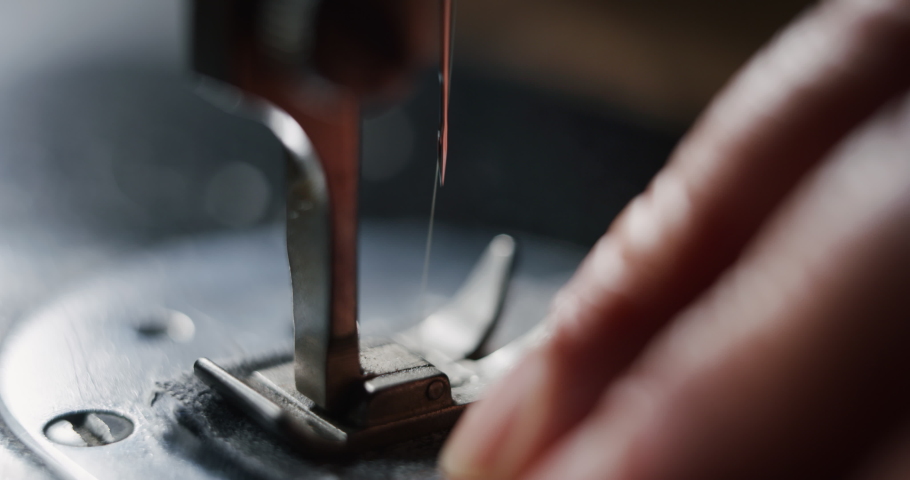 Cinematic macro shot of experienced tailor is sewing custom handmade high quality apparel in ancient luxury traditional tailoring atelier. Concept of industry, handmade, couturier and tradition. Royalty-Free Stock Footage #1064217907