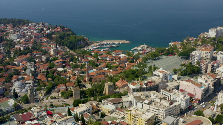 Idyllic landscape view of the old city of Antalya and the Bay with the port and yachts. Popular tourist Turkish resort and Riviera | Shutterstock HD Video #1064223412