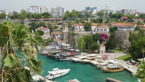 Idyllic landscape view of the old city of Antalya and the Bay with the port and yachts. Popular tourist Turkish resort and Riviera