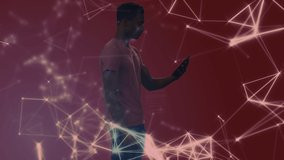 Digital composite video of network of connections and data processing over african american man using digital tablet against red background. global networking and modern technology concept.