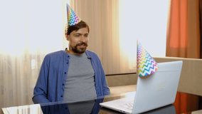 Young man celebrates a birthday in isolation