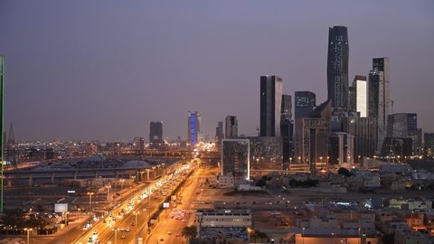 Riyadh City and King Abdullah Financial District time-lapse sunset aerial view. Main road King Fahd Road appears. twilight and sunset time.