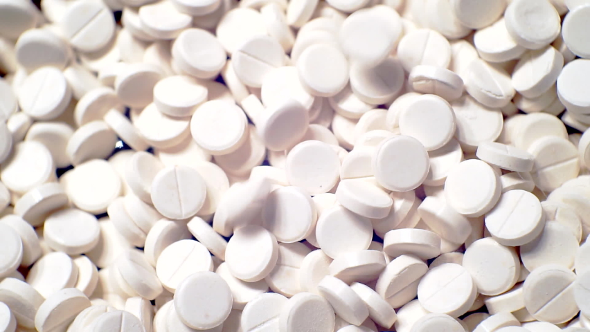 many white round pills pharmaceutical production Stockvideoklipp (helt roya...