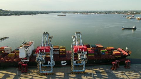 Montevideo, Uruguay; December 2020: Aerial view of container loading port with cranes and cargo ships