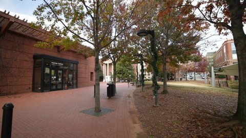 Charlottesville, VA, USA - 12012020: Downtown visitor center for tourism on pedestrian walking mall in Charlottesville, VA on a sunny autumn day.
