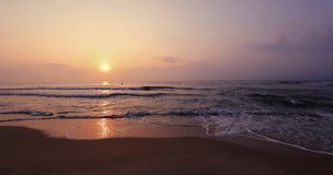 Beach sunrise over the sea and dramatic sea, 4k Video