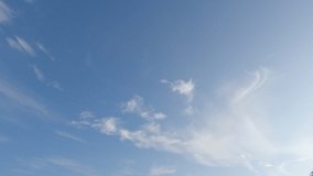 Fluffy puffy white cirrus or cirrostratus white cloud n cumulus cloudscape on beautiful sunny clear blue sky background in tropical summer or spring sunlight n sunray, 4k cinemagraphs b-roll TimeLapse