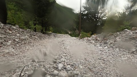 Driving Offroad From Theth To Shkodra In Bad Weather Conditions, Albania. Driving under very bad weather conditions, lots of rain, lots of water and very bad roads.