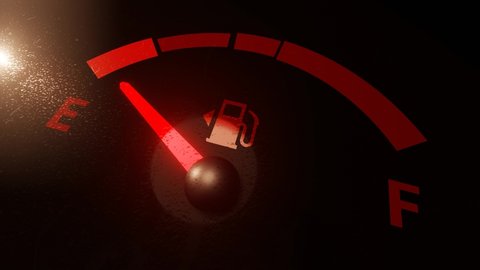 Extreme Closeup Fuel Gauge Car Dashboard Fills up. Petrol Meter In Red, Orange And Green On Black Background. Footage in 4K. Gasoline Prices, Tax concept. Lens Flare, Glows And Cinematic Color Grading