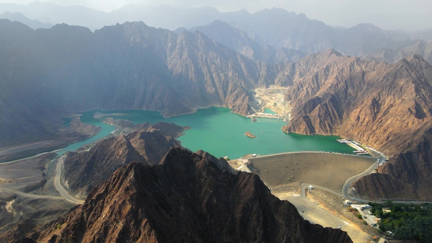 Hatta Dam Lake in mountains enclave region of Dubai, United Arab Emirates aerial footage | Shutterstock HD Video #1064315350