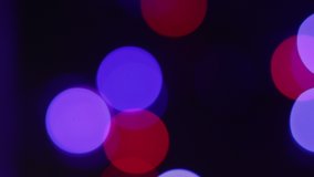 Abstract blur background. Shimmering colored circles defocused christmas lights video