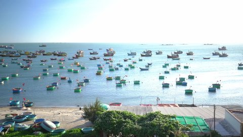 Fishing village in Mui Ne, Vietnam. Hundreds boats anchored in sunny moring. This is bay for boats avoid rainy season storms