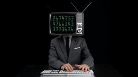 Businessman working on computer keyboard with television covering face and digits on monitor