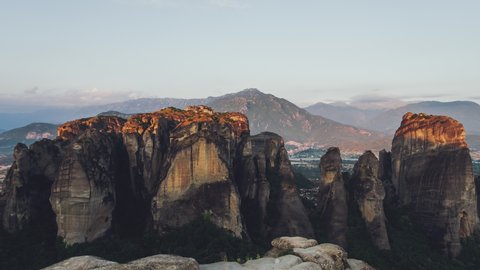 Aerial View of Meteora, Complex of Eastern Orthodox Monasteries, Greece, rising sun put light on top of hills