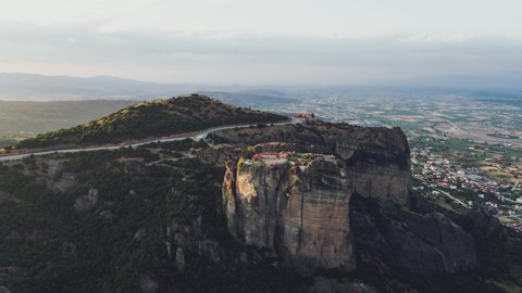 Aerial View of Meteora, Complex of Eastern Orthodox Monasteries, Greece, getting close to  Monastery of St. Stephen and Holy Trinity Monastery